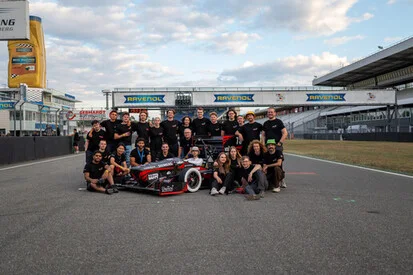 E-Traxx team gathered beside the car at Hockenheim